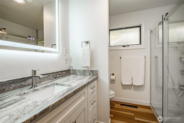 2483 Hilltop Rd, Ferndale, WA 98248 - full bathroom with vanity, a marble finish shower, and wood finished floors