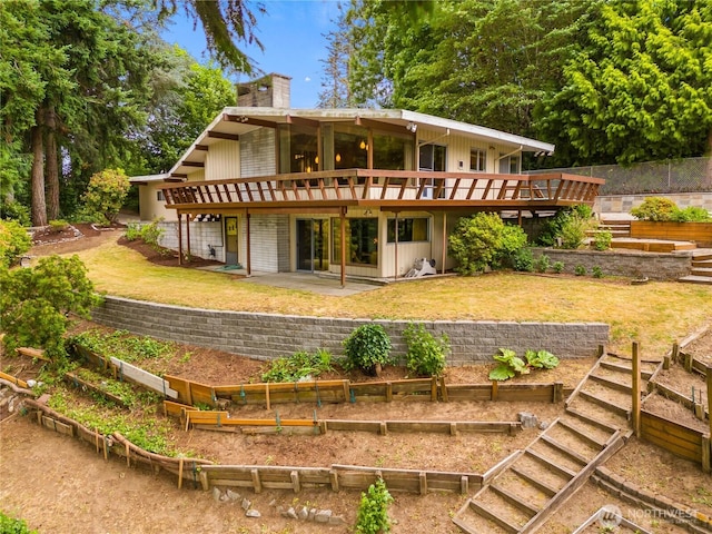 2219 Yelm Hwy SE, Olympia, WA 98501 - rear view of property with a wooden deck, a garden, a lawn, a chimney, and stairway