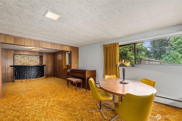 2219 Yelm Hwy SE, Olympia, WA 98501 - dining area with wooden walls, healthy amount of natural light, baseboard heating, and carpet