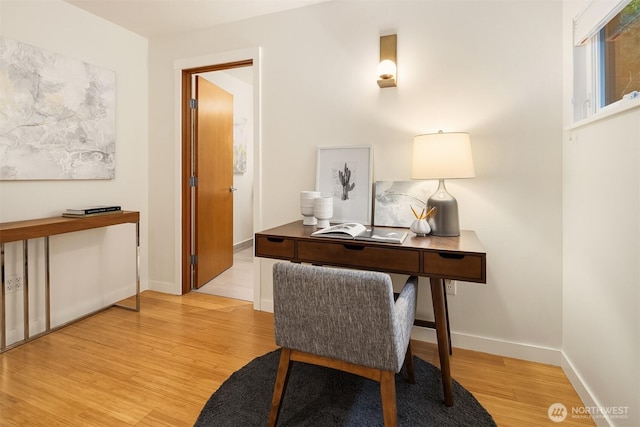 3659 Whitman Ave N, Seattle, WA 98103 - home office with light wood-style flooring and baseboards