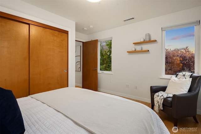 3659 Whitman Ave N, Seattle, WA 98103 - bedroom featuring wood finished floors and a closet