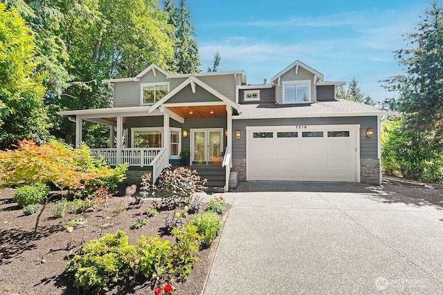 7516 181st Pl SW, Edmonds, WA 98026 - view of front of house with driveway, covered porch, and stone siding