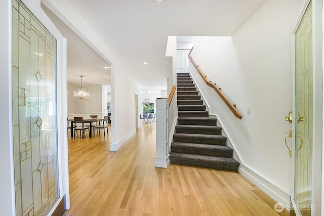 7516 181st Pl SW, Edmonds, WA 98026 - entryway with stairway, light wood finished floors, a chandelier, and recessed lighting