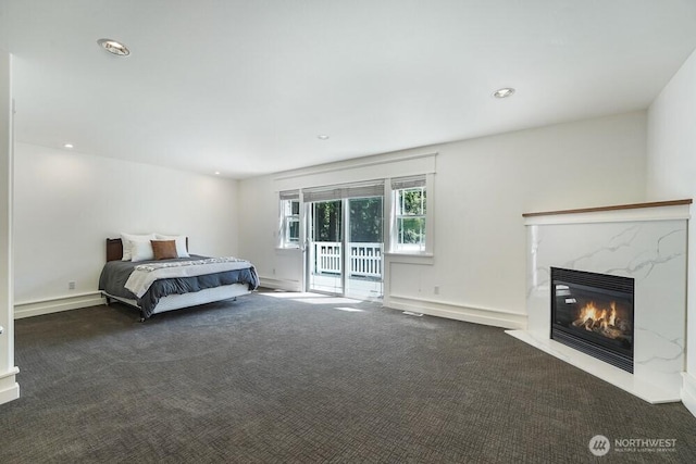 7516 181st Pl SW, Edmonds, WA 98026 - carpeted bedroom with access to outside, a premium fireplace, and recessed lighting