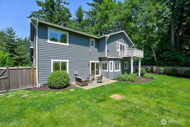 7516 181st Pl SW, Edmonds, WA 98026 - back of property featuring a balcony, a fenced backyard, a patio, and an outdoor living space