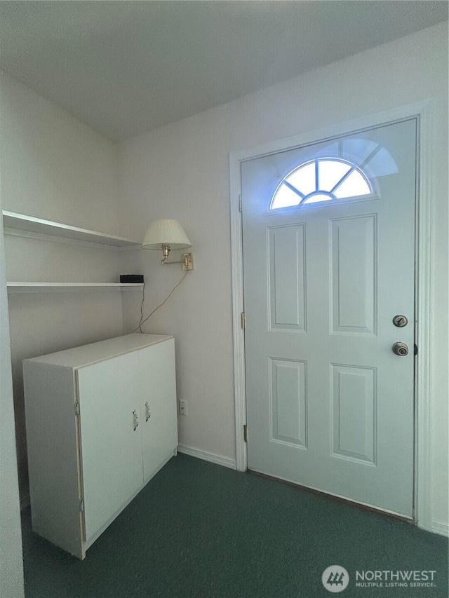 72 Misty Glen Ln, Sequim, WA 98382 - foyer with dark colored carpet and baseboards
