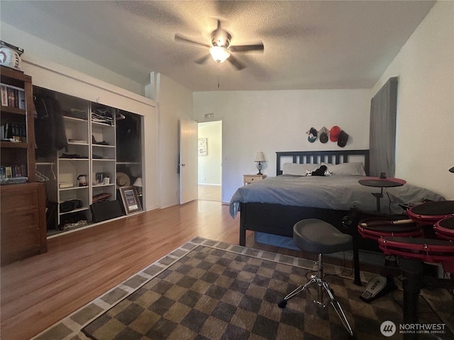 72 Misty Glen Ln, Sequim, WA 98382 - bedroom with wood finished floors, a textured ceiling, and ceiling fan