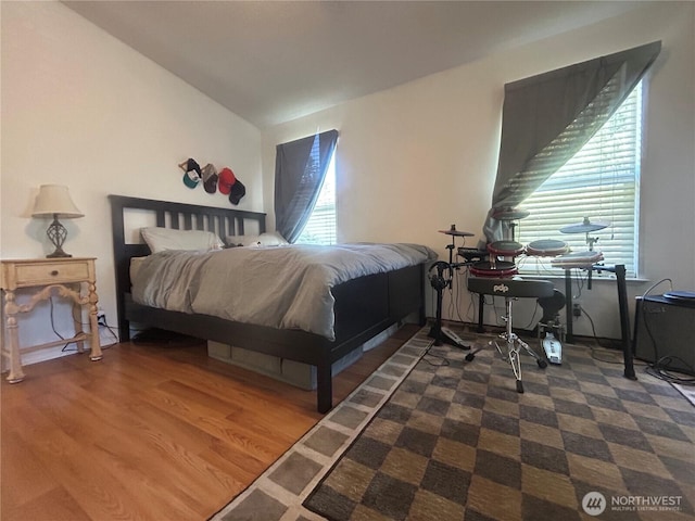 72 Misty Glen Ln, Sequim, WA 98382 - bedroom featuring wood finished floors and lofted ceiling
