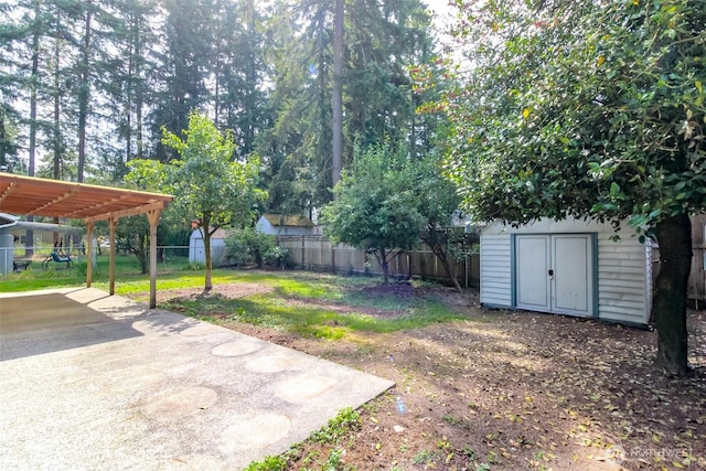 26622 190th Ave SE, Covington, WA 98042 - fenced backyard with a storage unit, a patio, and a carport