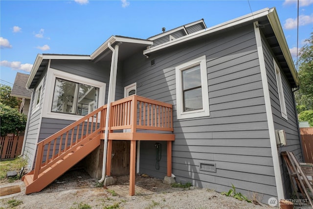 8739 17th Ave NW, Seattle, WA 98117 - rear view of house with stairway and a wooden deck
