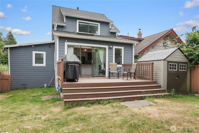 8739 17th Ave NW, Seattle, WA 98117 - rear view of house featuring a wooden deck, a storage unit, and a shingled roof