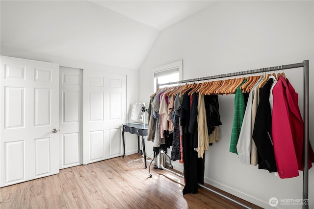 8739 17th Ave NW, Seattle, WA 98117 - spacious closet with lofted ceiling and wood finished floors