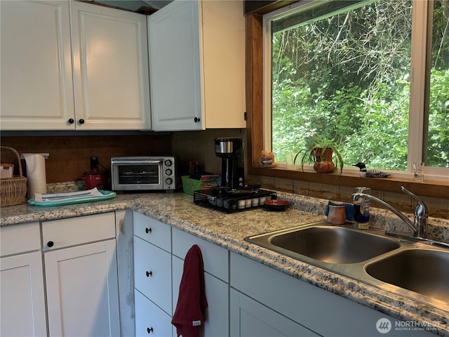 27805 L Pl, Ocean Park, WA 98640 - kitchen featuring white cabinets and light countertops