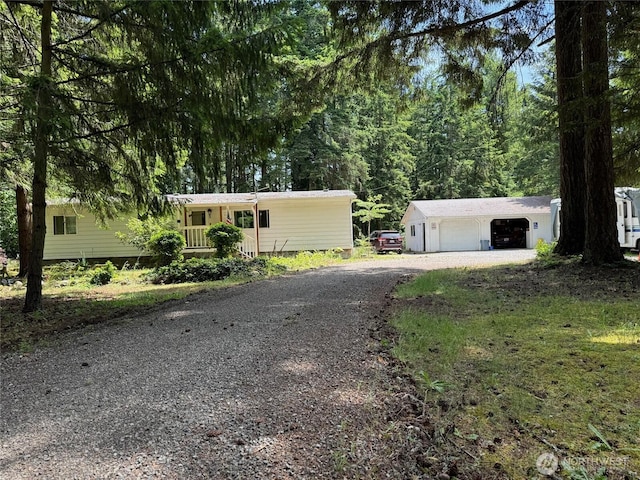 20115 92nd Ave E, Graham, WA 98338 - view of front of property featuring gravel driveway and a garage