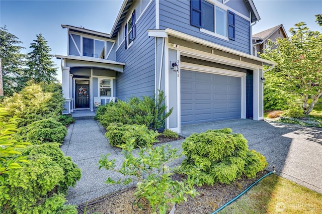21598 NW Monterey Loop, Poulsbo, WA 98370 - view of exterior entry with an attached garage and asphalt driveway