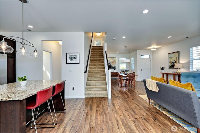 21598 NW Monterey Loop, Poulsbo, WA 98370 - living room featuring stairs, recessed lighting, and dark wood-style flooring