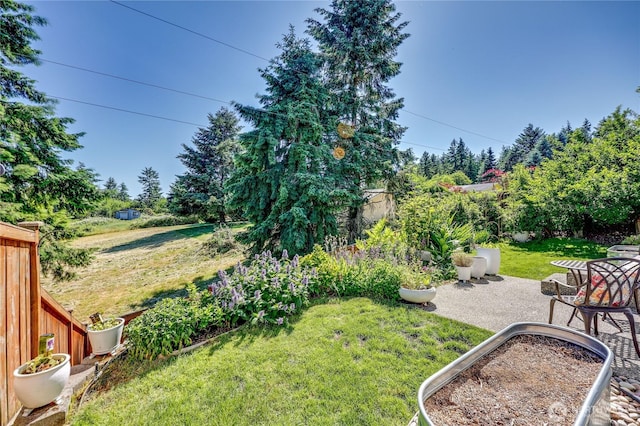 21598 NW Monterey Loop, Poulsbo, WA 98370 - view of grassy yard with a patio