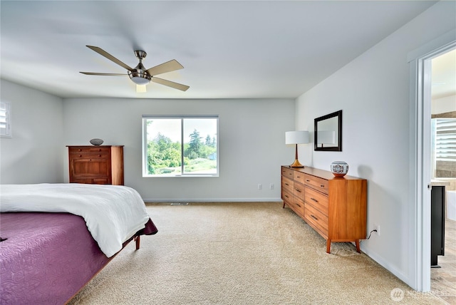 21598 NW Monterey Loop, Poulsbo, WA 98370 - bedroom with light carpet and a ceiling fan