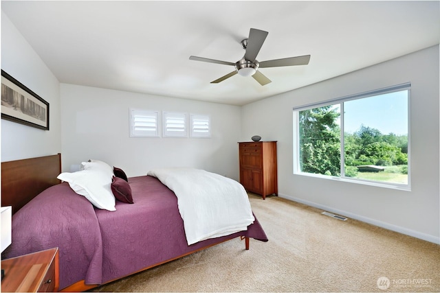 21598 NW Monterey Loop, Poulsbo, WA 98370 - carpeted bedroom featuring baseboards and ceiling fan