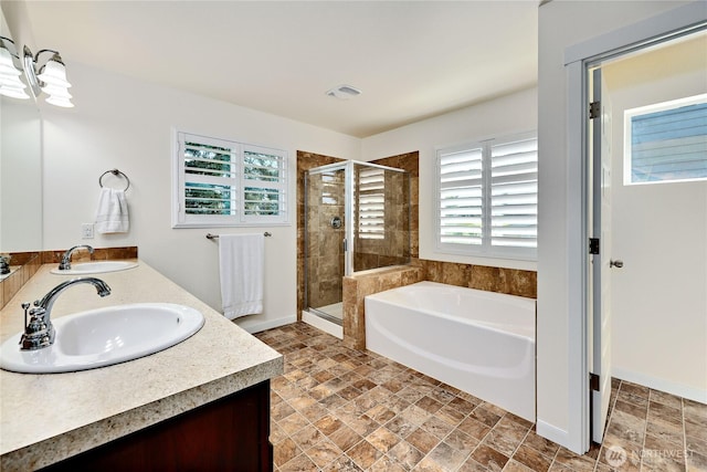 21598 NW Monterey Loop, Poulsbo, WA 98370 - bathroom featuring a shower stall, a bath, double vanity, and stone finish floors