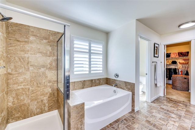 21598 NW Monterey Loop, Poulsbo, WA 98370 - bathroom featuring a shower stall, a garden tub, and a spacious closet