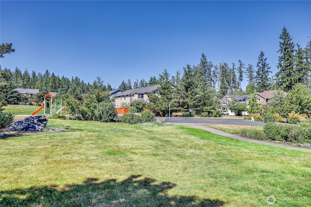 21598 NW Monterey Loop, Poulsbo, WA 98370 - view of green lawn featuring a playground and a residential view