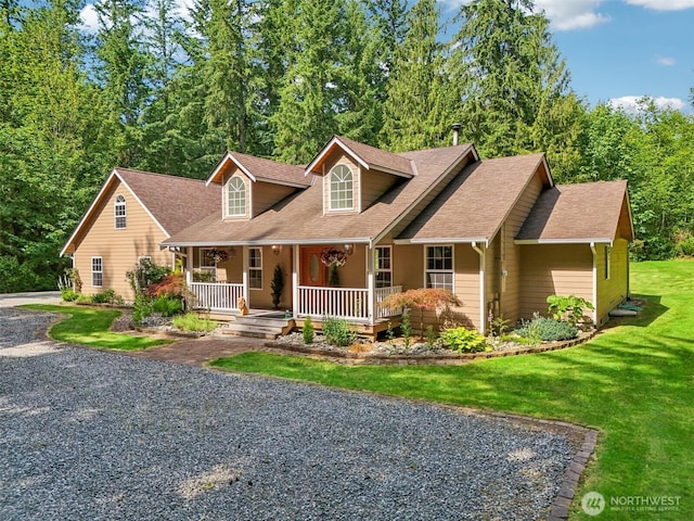 6611 Menzel Lake Rd, Granite Falls, WA 98252 - new england style home featuring a porch, driveway, a shingled roof, and a front yard