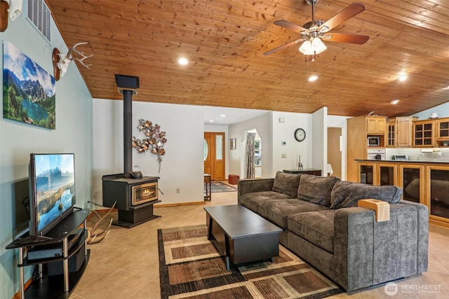 6611 Menzel Lake Rd, Granite Falls, WA 98252 - living room featuring a wood stove, wood ceiling, light tile patterned floors, a ceiling fan, and recessed lighting