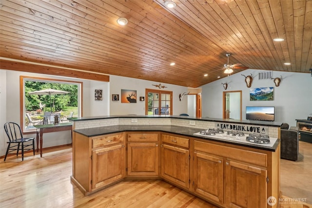 6611 Menzel Lake Rd, Granite Falls, WA 98252 - kitchen featuring white gas stovetop, open floor plan, vaulted ceiling, wooden ceiling, and recessed lighting
