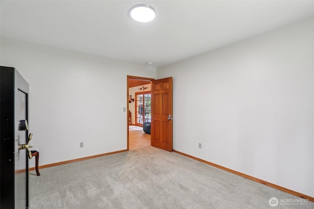 6611 Menzel Lake Rd, Granite Falls, WA 98252 - spare room featuring baseboards and light colored carpet