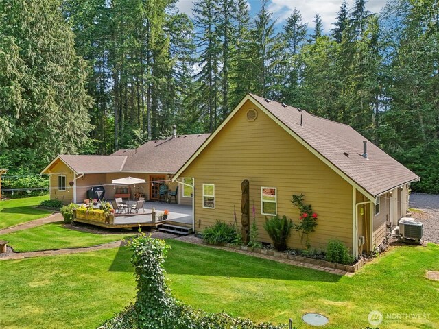 6611 Menzel Lake Rd, Granite Falls, WA 98252 - back of property featuring a wooden deck, a lawn, and roof with shingles