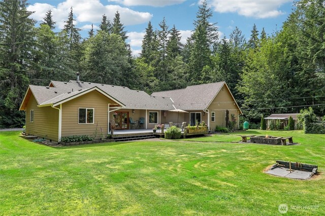 6611 Menzel Lake Rd, Granite Falls, WA 98252 - rear view of property featuring a fire pit, a yard, and a wooden deck