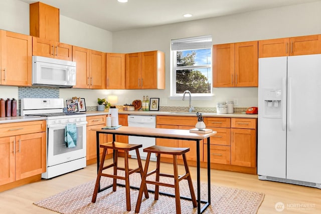4241 S Eddy St, Seattle, WA 98118 - kitchen with white appliances, light wood finished floors, recessed lighting, and light countertops