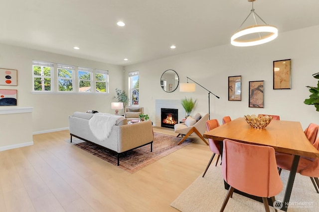 4241 S Eddy St, Seattle, WA 98118 - living room featuring a glass covered fireplace, plenty of natural light, light wood finished floors, and recessed lighting