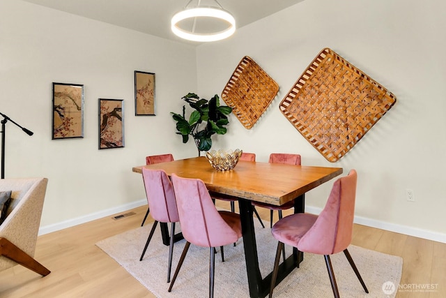 4241 S Eddy St, Seattle, WA 98118 - dining space featuring light wood-type flooring and baseboards