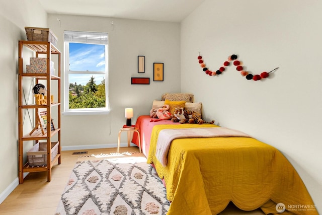 4241 S Eddy St, Seattle, WA 98118 - bedroom with baseboards and light wood-type flooring