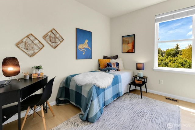 4241 S Eddy St, Seattle, WA 98118 - bedroom with wood finished floors and baseboards