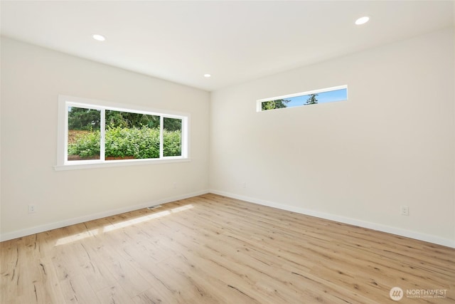 3124 Oas Dr W, University Place, WA 98466 - spare room with plenty of natural light, wood finished floors, and recessed lighting