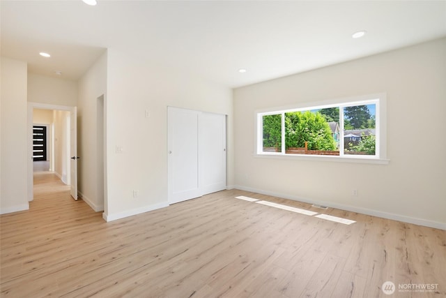 3124 Oas Dr W, University Place, WA 98466 - unfurnished bedroom featuring light wood-style floors, recessed lighting, and a closet