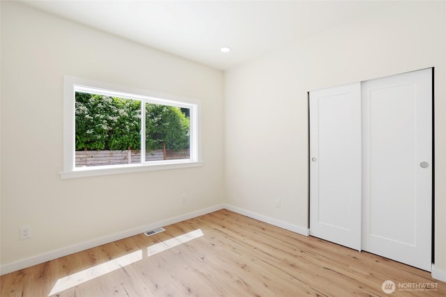 3124 Oas Dr W, University Place, WA 98466 - unfurnished bedroom featuring wood finished floors, a closet, and recessed lighting