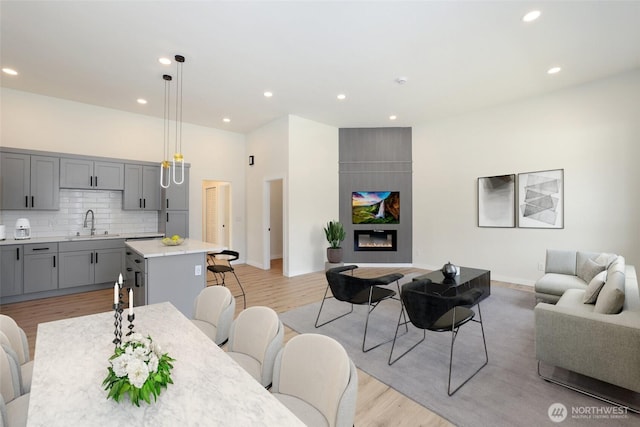3124 Oas Dr W, University Place, WA 98466 - living room with light wood-type flooring, recessed lighting, and a fireplace