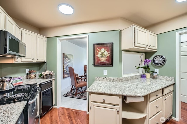 7930SE 34th St Unit 209, Mercer Island, WA 98040 - kitchen with stainless steel appliances, wood finished floors, and white cabinetry