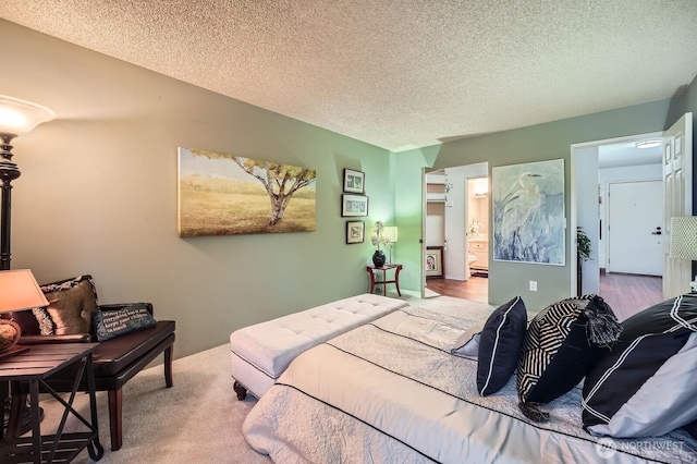 7930SE 34th St Unit 209, Mercer Island, WA 98040 - bedroom featuring a textured ceiling and ensuite bathroom