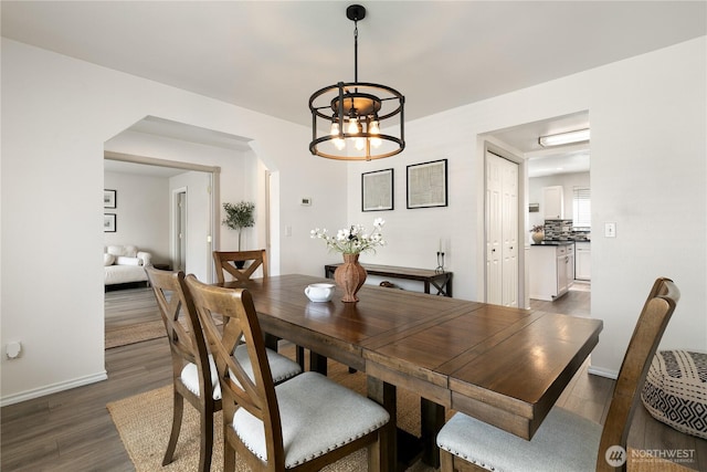 21323 47th Ave E, Spanaway, WA 98387 - dining area with dark wood-type flooring and a chandelier