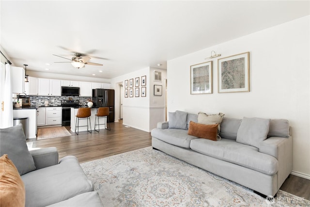 21323 47th Ave E, Spanaway, WA 98387 - living area with ceiling fan, wood finished floors, and recessed lighting