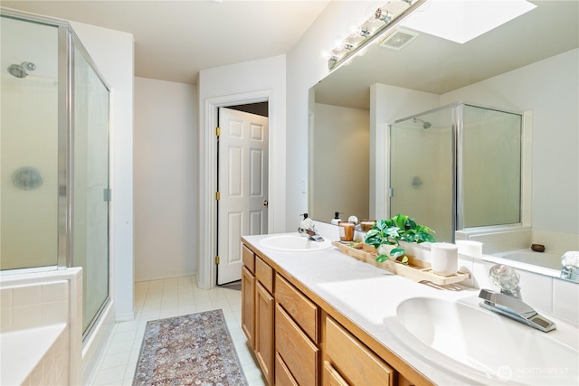 21323 47th Ave E, Spanaway, WA 98387 - bathroom featuring a skylight, a shower stall, double vanity, and a bath