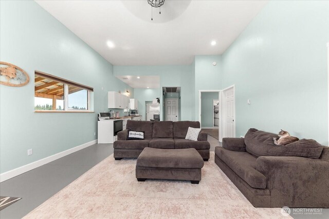 40359 Barbara Ln N, Davenport, WA 99122 - living area featuring baseboards, concrete floors, and a ceiling fan