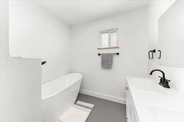 40359 Barbara Ln N, Davenport, WA 99122 - full bath with a freestanding tub, double vanity, and baseboards