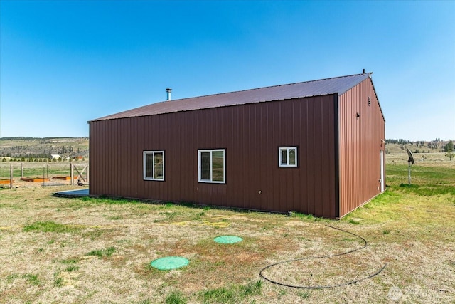 40359 Barbara Ln N, Davenport, WA 99122 - view of side of property featuring an outdoor structure, metal roof, and a view of countryside