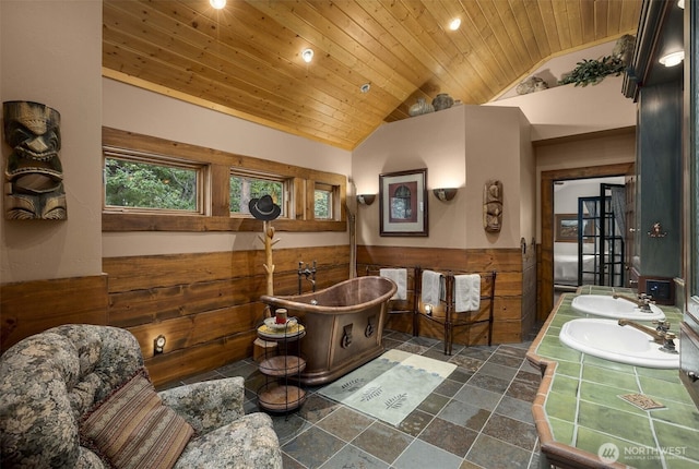 6286 Five Mile Rd, The Dalles, OR 98058 - full bath featuring wooden ceiling, lofted ceiling, wainscoting, a freestanding bath, and double vanity